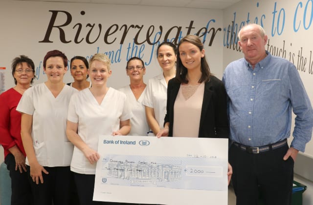 Father and daughter present €2,000 cheque for cancer patient comfort at UHG. Father and daughter present €2,000 cheque for cancer patient comfort at UHG.
